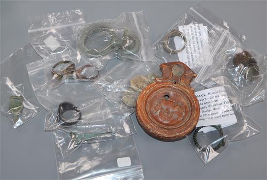 A small collection of antiquities, comprising a Roman bronze finger ring (30th Legion), a silver finger ring and sundries